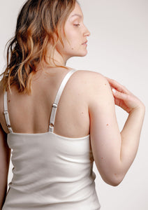 Back of model wearing Viola nursing top in colour ivory