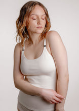 Load image into Gallery viewer, Model closing her eyes wearing Viola nursing top in colour ivory
