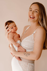 Model holding her baby laughing wearing Vienna nursing bra and Lemonie high waist in colour ivory