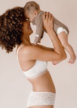 Load image into Gallery viewer, Mother holding her baby wearing Valeria nursing bra and Leia hipster in ivory
