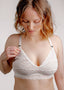 Model looking down wearing vienna nursing bra in ivory