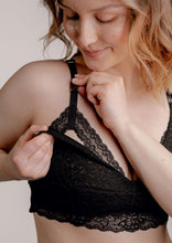 Load image into Gallery viewer, Model wearing Vienna nursing bra in black showing how you can open the nursing bra
