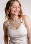 Model smiling wearing Viola nursing top in colour ivory